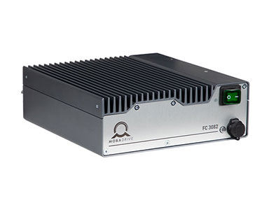 Product image of the MOBADRIVE FC 3082 shown from a slightly elevated front-left three-quarter perspective, highlighting the front faceplate, top heat sink and compact industrial housing.