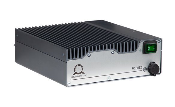 Product image of the MOBADRIVE FC 3082 shown from a slightly elevated front-left three-quarter perspective, highlighting the front faceplate, top heat sink and compact industrial housing.