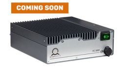 Product image of the MOBADRIVE FC 3082 shown from a slightly elevated front-left three-quarter perspective, highlighting the front faceplate, top heat sink and compact industrial housing, with coming soon placeholder marking